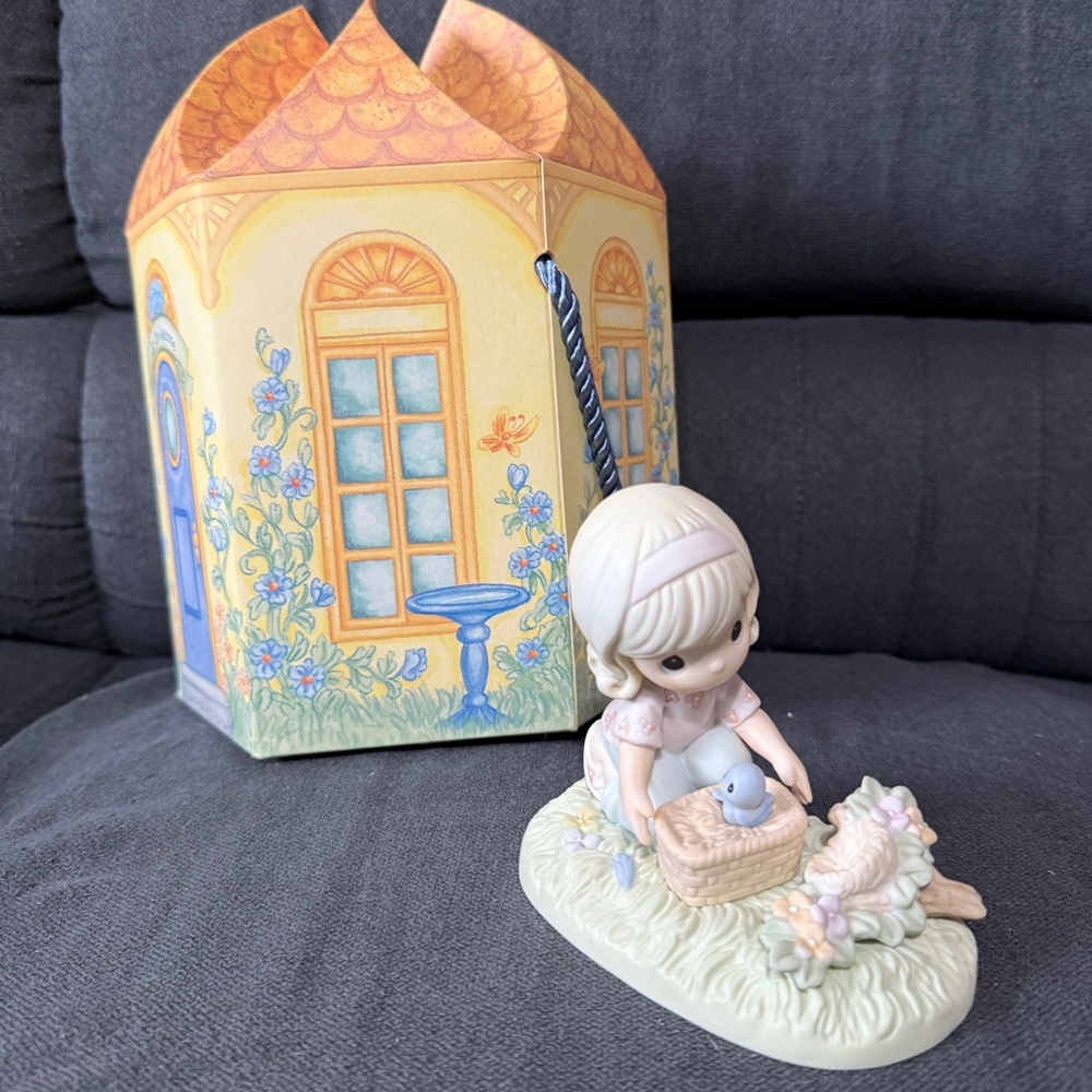 Precious Moments - “It Only Takes A Moment To Show You Care” Figurine
